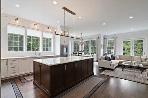 a kitchen with stainless steel appliances granite countertop a stove and a sink