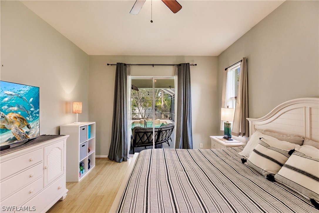 12901 Timber Ridge Drive Fort Myers, FL 33913 - Photo 23 of 49 a spacious bedroom with a bed and a dresser next to a window