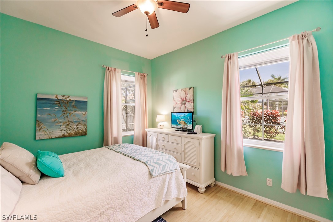 12901 Timber Ridge Drive Fort Myers, FL 33913 - Photo 28 of 49 a bedroom with a bed and a window