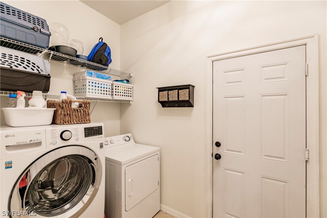 12901 Timber Ridge Drive Fort Myers, FL 33913 - Photo 34 of 49 a view of storage and utility room with washer and dryer