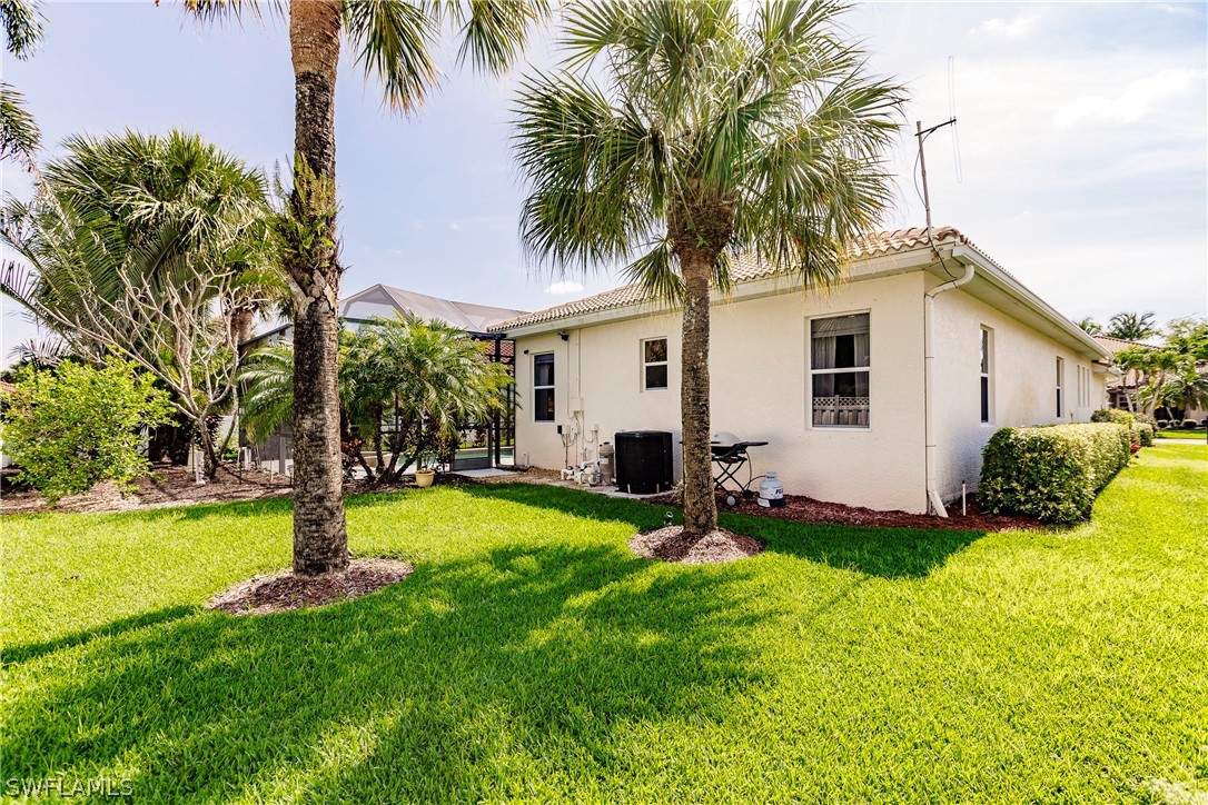 12901 Timber Ridge Drive Fort Myers, FL 33913 - Photo 42 of 49 a front view of house with yard and entertaining space
