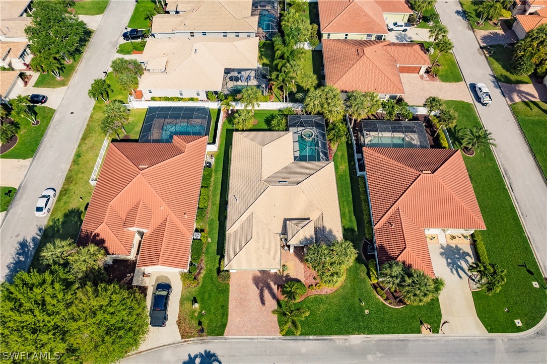12901 Timber Ridge Drive Fort Myers, FL 33913 - Photo 44 of 49 an aerial view of a house with a yard and garden