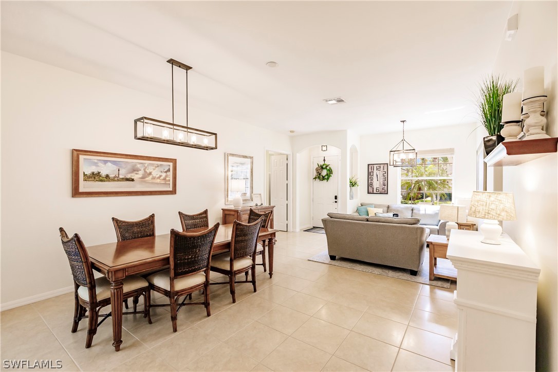 12901 Timber Ridge Drive Fort Myers, FL 33913 - Photo 10 of 49 a dining room with furniture and wooden floor