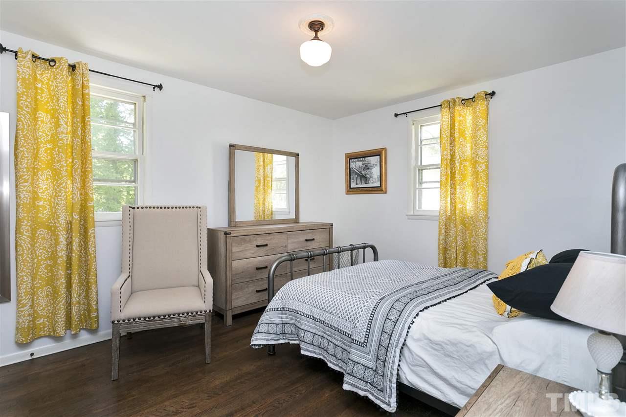 3417 Apache Drive Raleigh, NC 27609 - Photo 11 of 25 a bedroom with two beds and a window