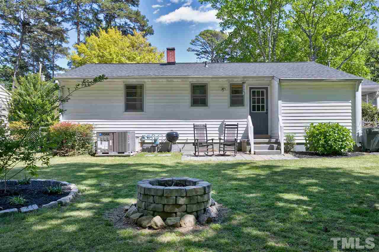 3417 Apache Drive Raleigh, NC 27609 - Photo 20 of 25 a front view of a house with a garden
