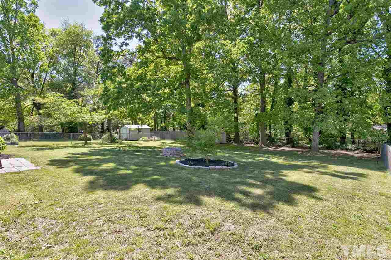 3417 Apache Drive Raleigh, NC 27609 - Photo 21 of 25 a view of a trees with a yard