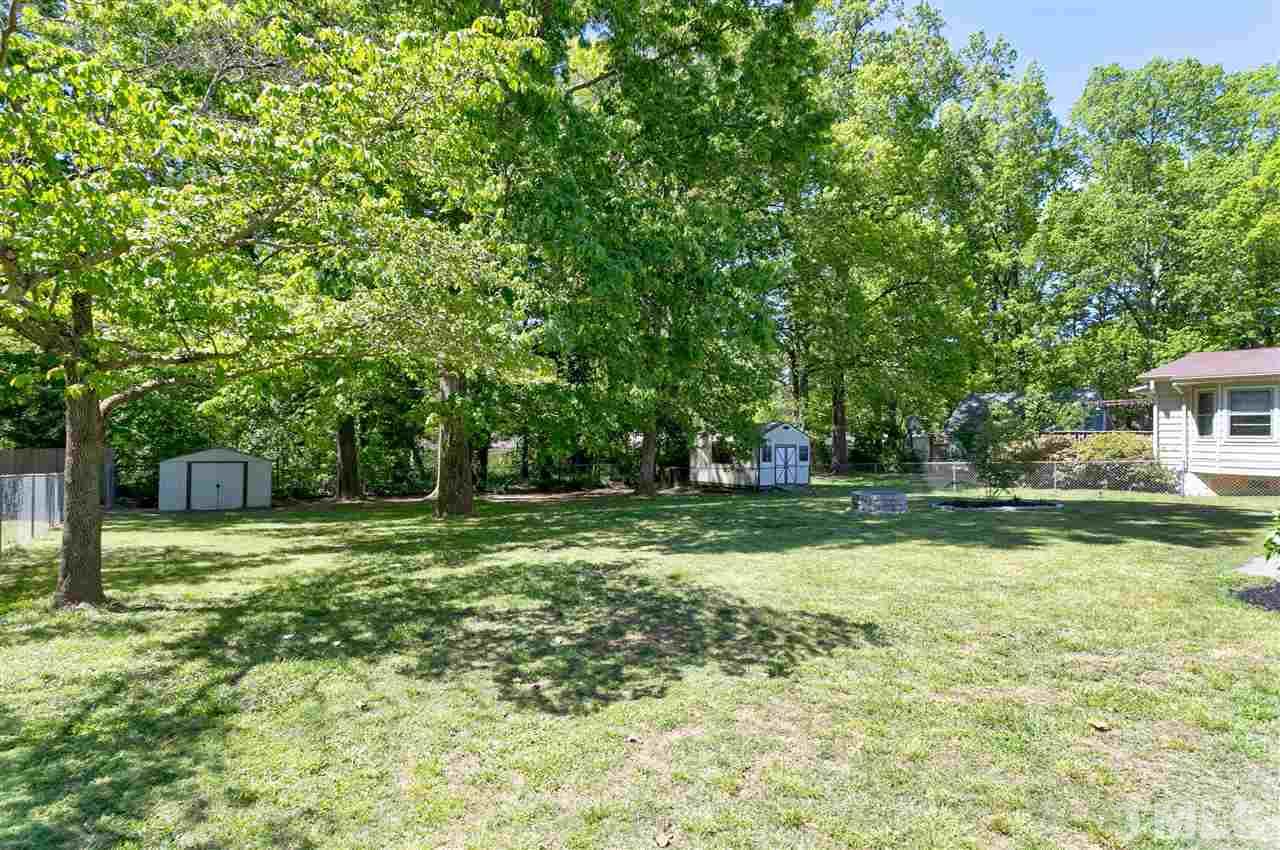 3417 Apache Drive Raleigh, NC 27609 - Photo 22 of 25 a backyard of a house with swimming pool and green space