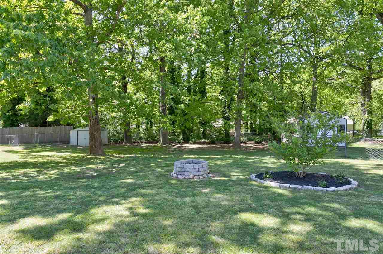 3417 Apache Drive Raleigh, NC 27609 - Photo 23 of 25 a backyard of a house with lots of green space