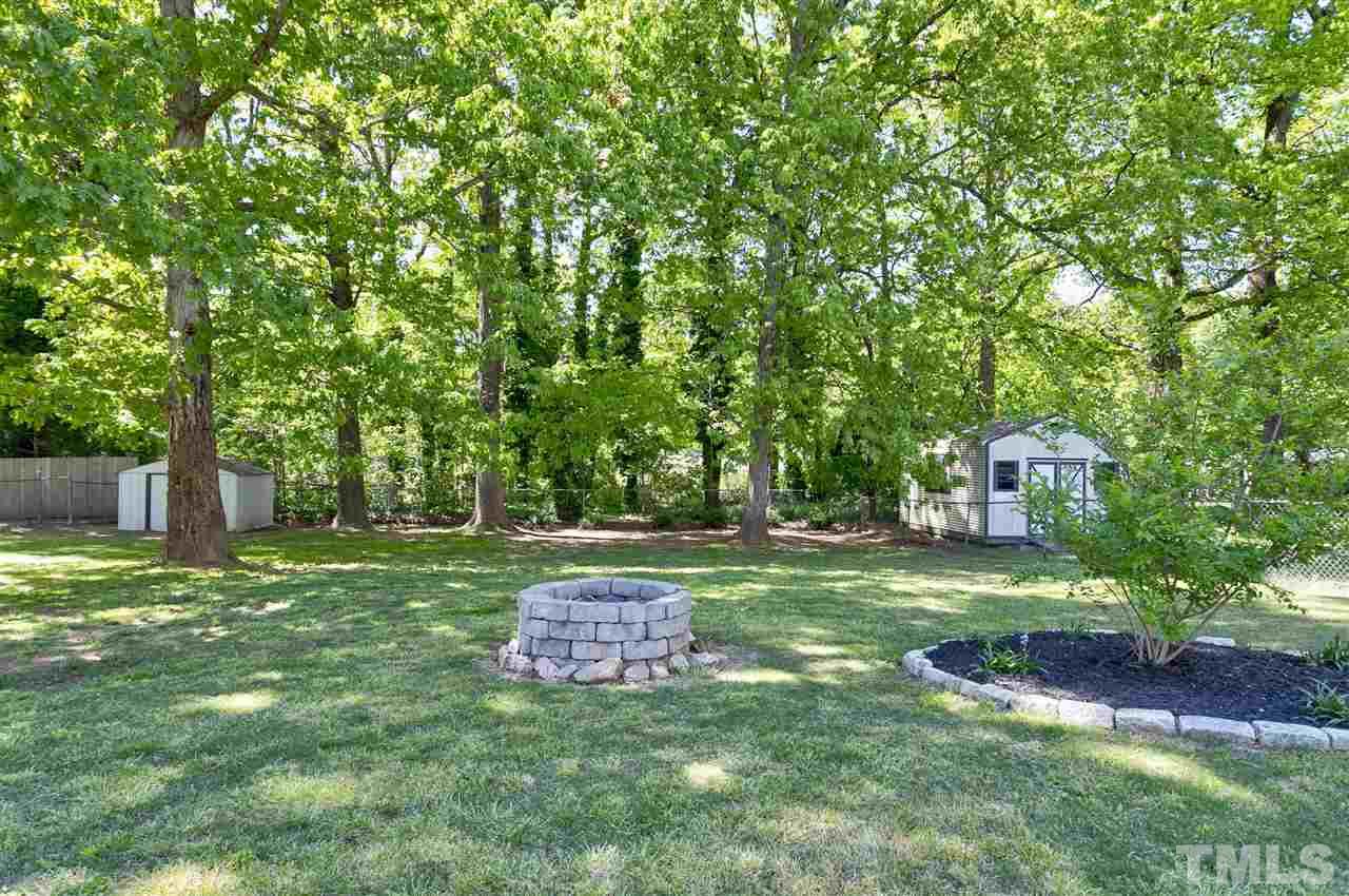 3417 Apache Drive Raleigh, NC 27609 - Photo 24 of 25 a big yard with lots of green space and plants
