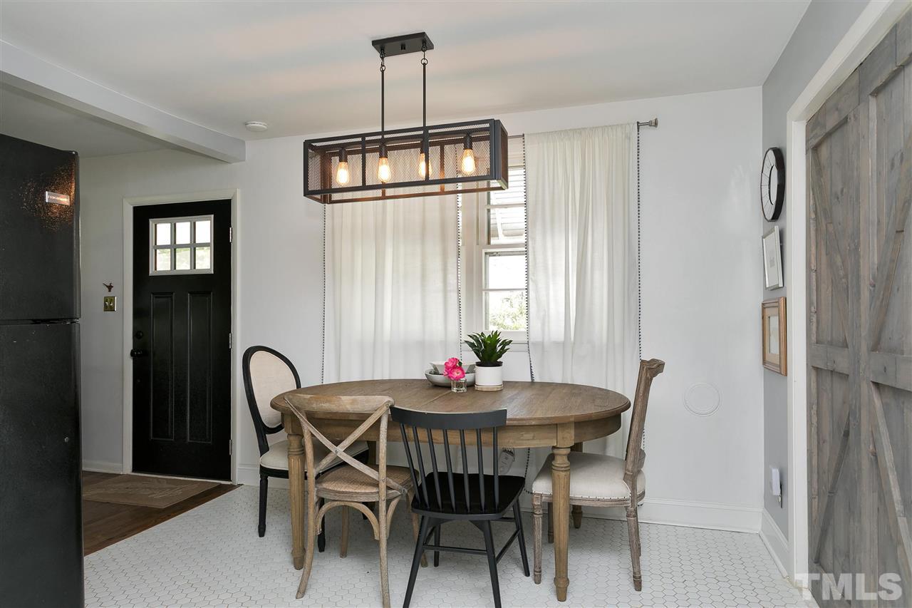 3417 Apache Drive Raleigh, NC 27609 - Photo 8 of 25 a view of a dining room with furniture window and outside view