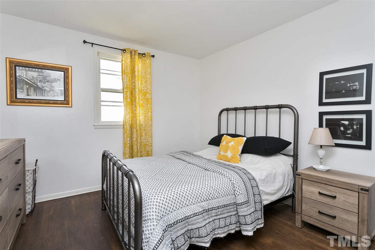 3417 Apache Drive Raleigh, NC 27609 - Photo 10 of 25 a bedroom with a bed and a window