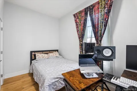 a bedroom with a bed and a bookshelf