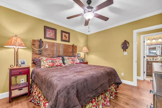 a bedroom with a bed and a chandelier