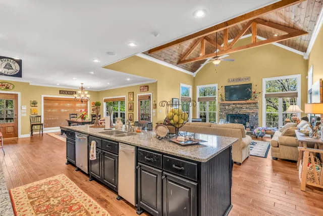 a open kitchen with stainless steel appliances granite countertop a stove and cabinets