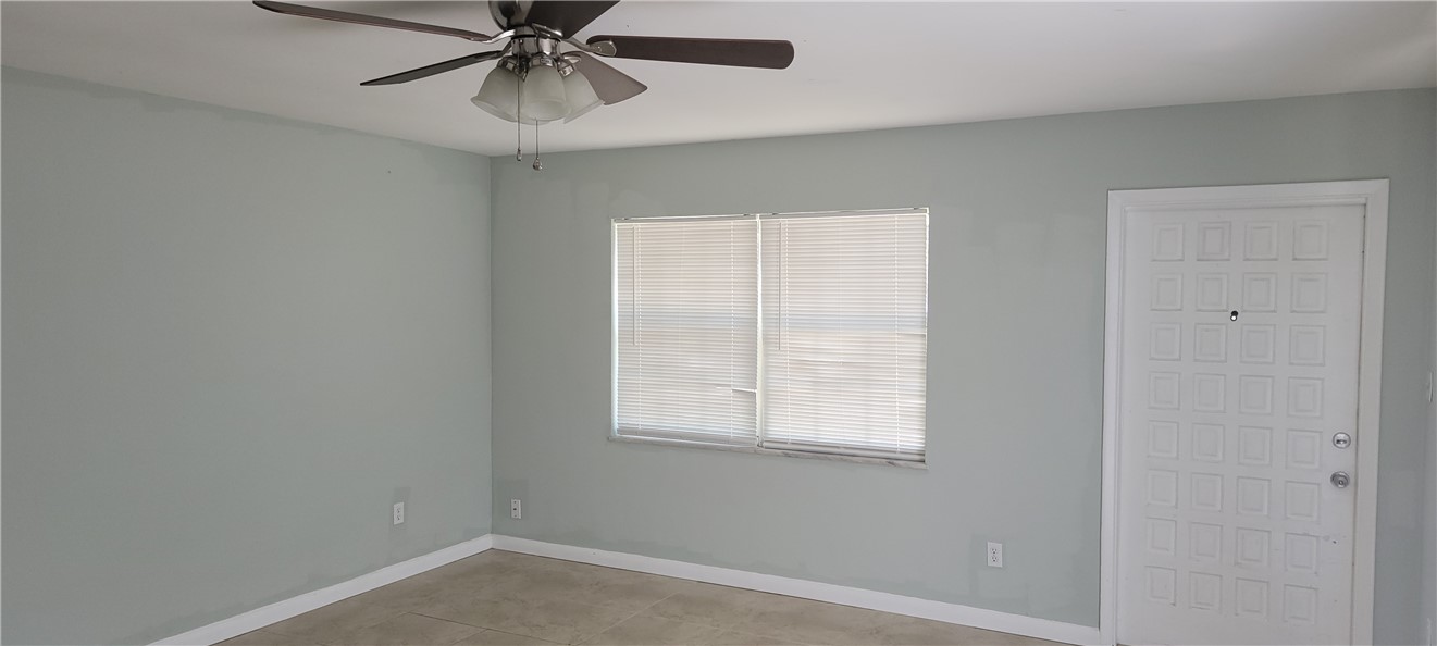 412 7th Road Southwest Vero Beach, FL 32962 - Photo 5 of 19 an empty room with a window and a fan