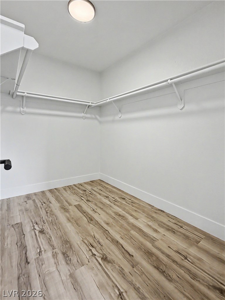 8977 Paige Rene Court Las Vegas, NV 89117 - Photo 6 of 31 Ample hanging space and durable flooring define this well-appointed closet.