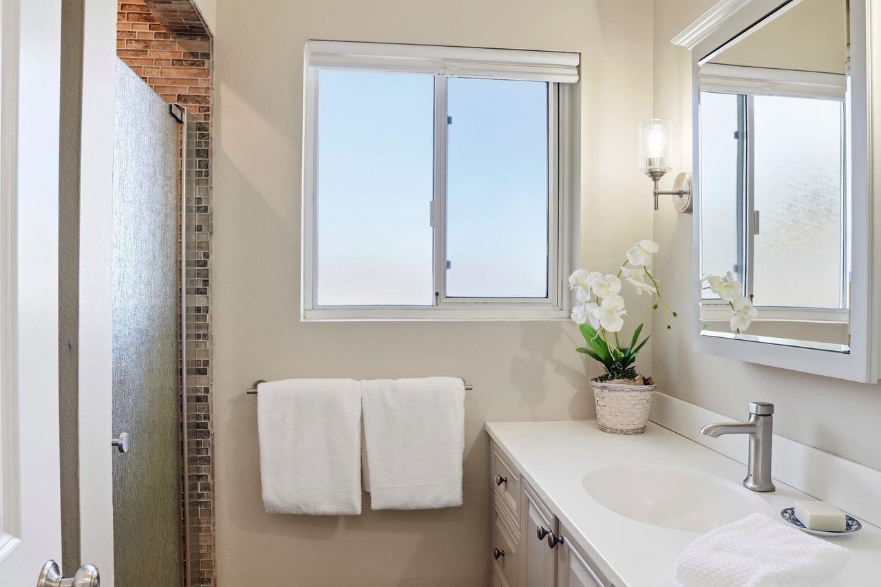 701 Archer Street Monterey, CA 93940 - Photo 22 of 39 a bathroom with a sink a vanity and a mirror