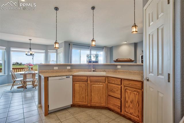 8345 Fort Smith Road Peyton, CO 80831 - Photo 21 of 50 Kitchen looking to the Living Room and Eat-in area