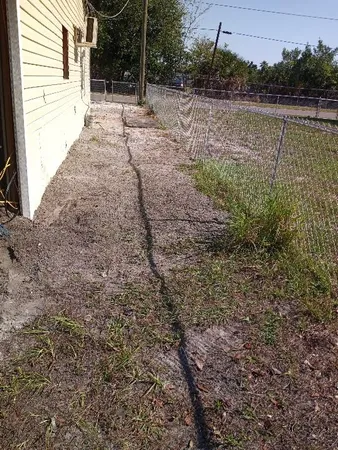a view of a backyard of a house