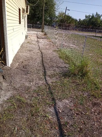 a view of a backyard of a house