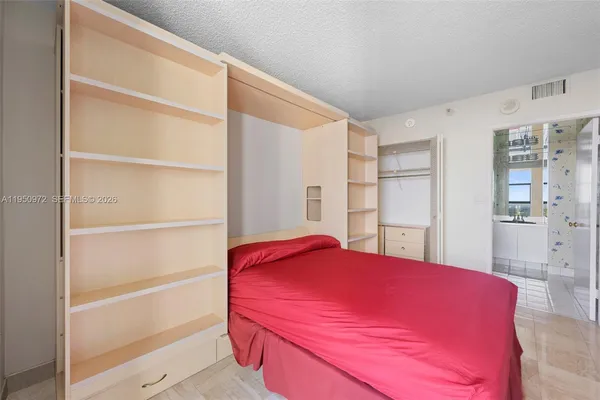 a bed room with a bed and a window