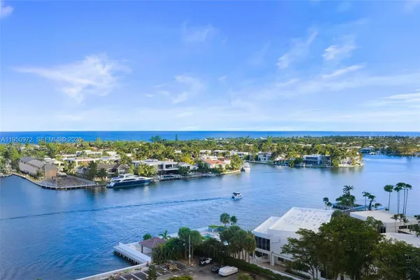 an aerial view of a house with a lake view