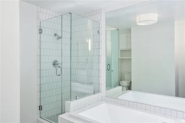 a bathroom with a bathtub and shower