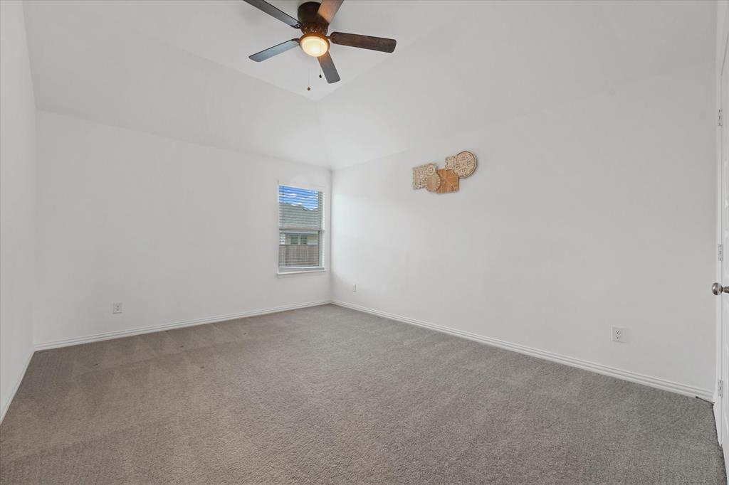 3533 Hyacinth Way Prosper, TX 75078 - Photo 26 of 38 an empty room with a ceiling fan and window