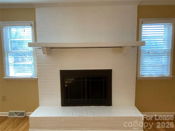 a fireplace with a wooden floor
