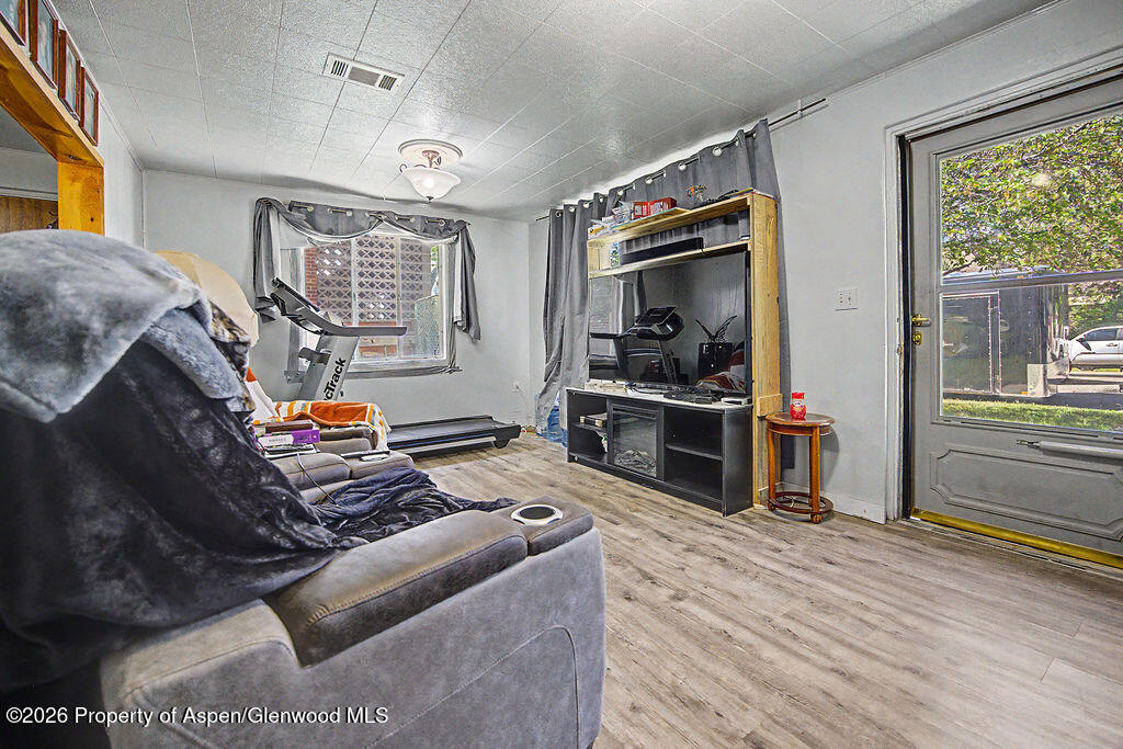 625 Russell Street Craig, CO 81625 - Photo 18 of 35 a living room with furniture and a window