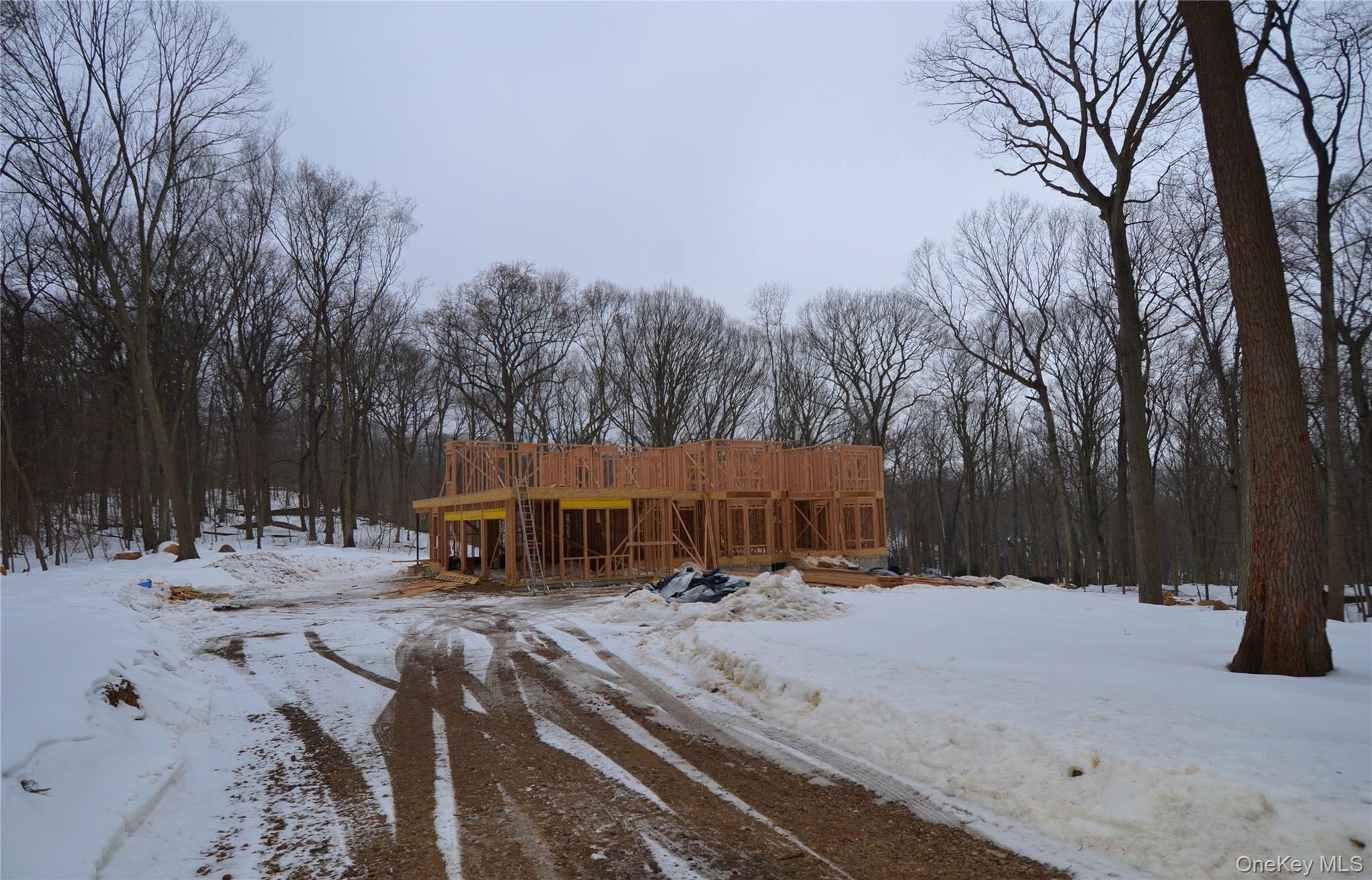 550 Moriches Road Head Of The Harbor, NY 11780 - Photo 2 of 17 a view of a large white house with a yard covered in snow