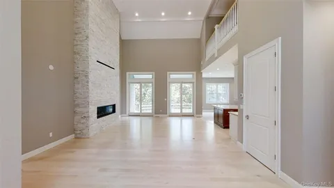 a view of an entryway with wooden floor