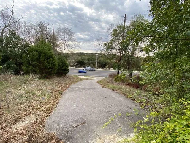 a view of a road with a yard