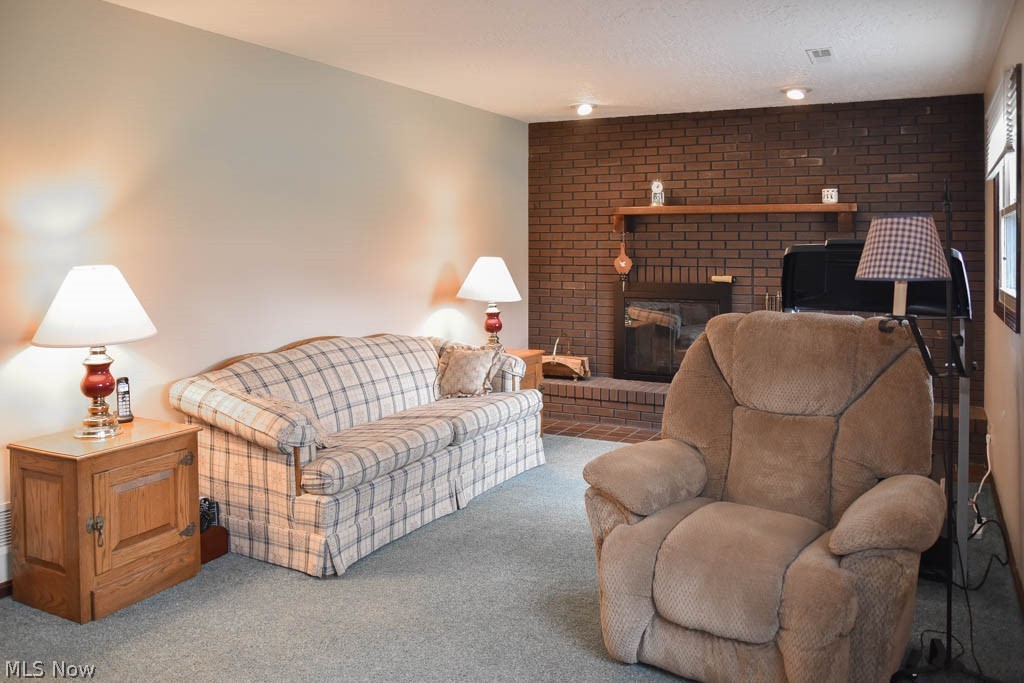 6955 Taylor Road Clinton, OH 44216 - Photo 10 of 26 Family room with a brick fireplace.