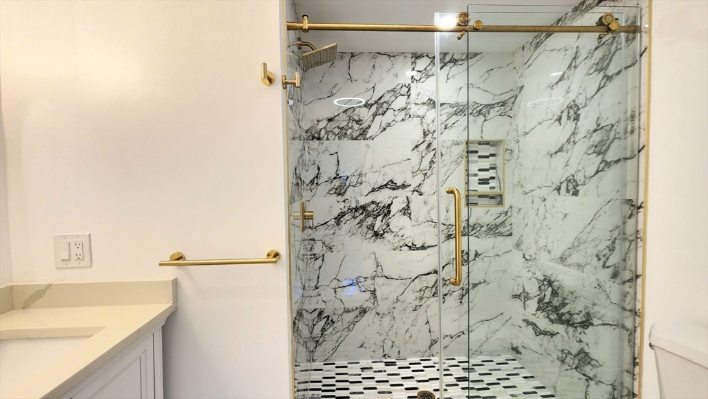 11 Christopher Road Brockton, MA 02302 - Photo 11 of 22 a bathroom with a shower curtain and a sink