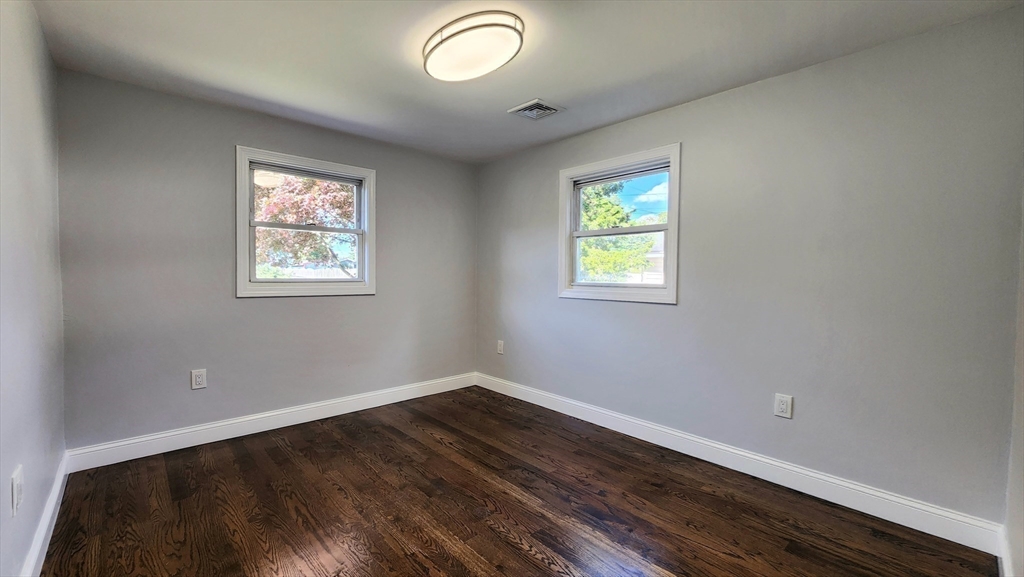 11 Christopher Road Brockton, MA 02302 - Photo 13 of 22 wooden floor in an empty room with a window
