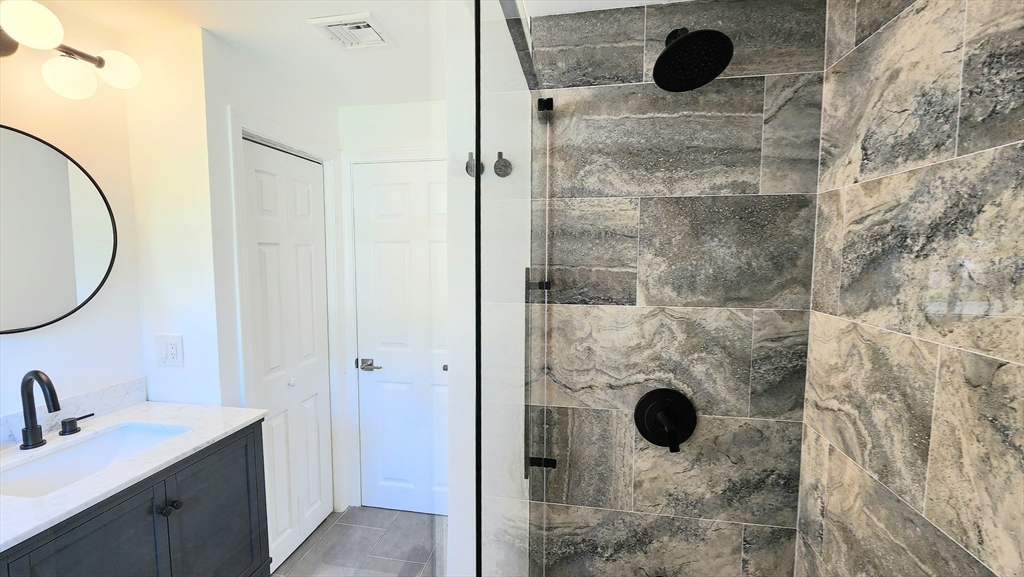 11 Christopher Road Brockton, MA 02302 - Photo 16 of 22 a bathroom with a sink and a mirror