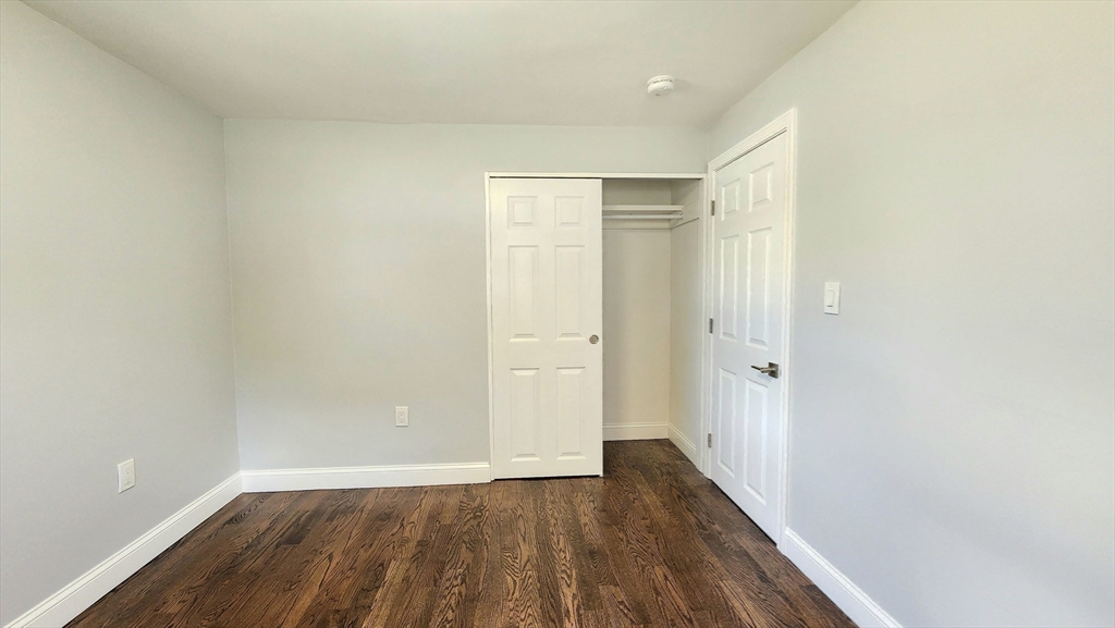 11 Christopher Road Brockton, MA 02302 - Photo 18 of 22 a view of a hallway with wooden floor
