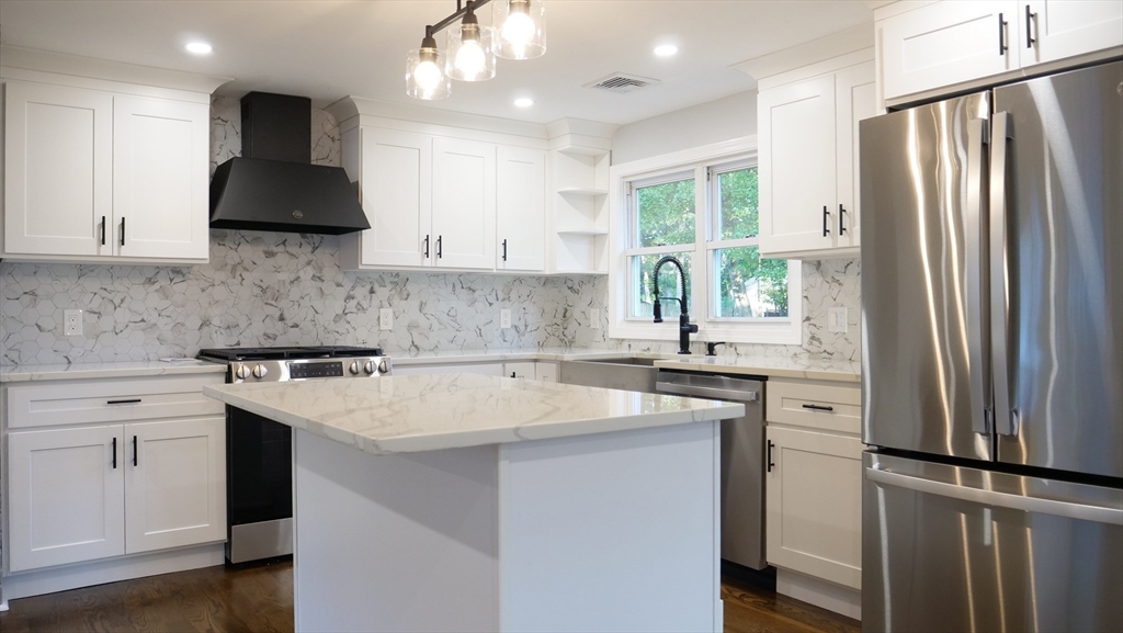 11 Christopher Road Brockton, MA 02302 - Photo 5 of 22 a kitchen with stainless steel appliances a sink stove and refrigerator