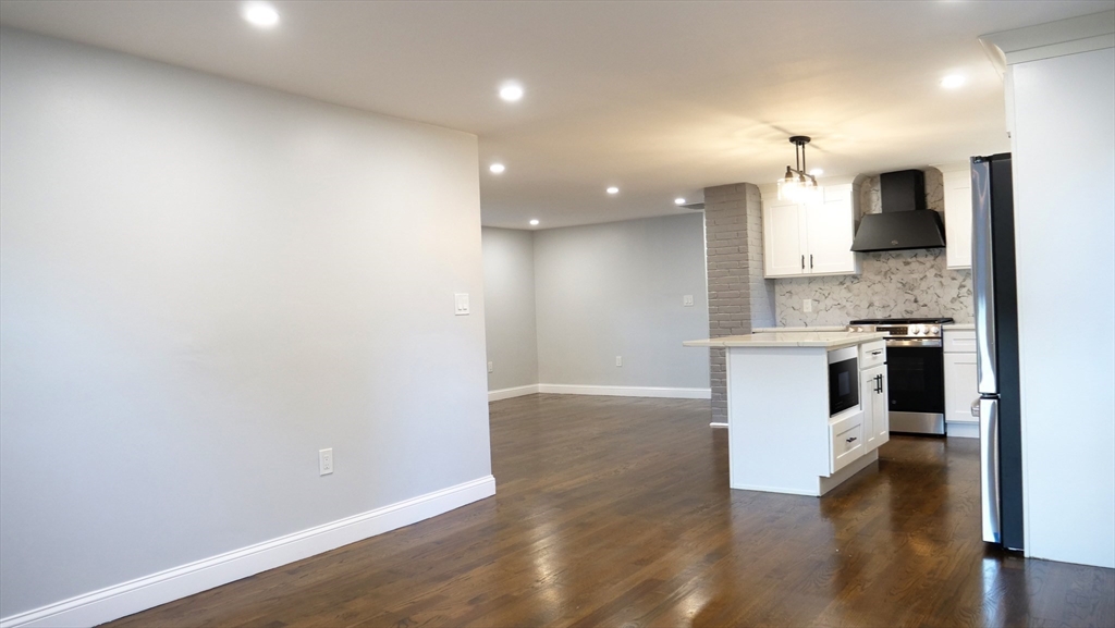 11 Christopher Road Brockton, MA 02302 - Photo 6 of 22 a large kitchen with lot of counter space and wooden floor