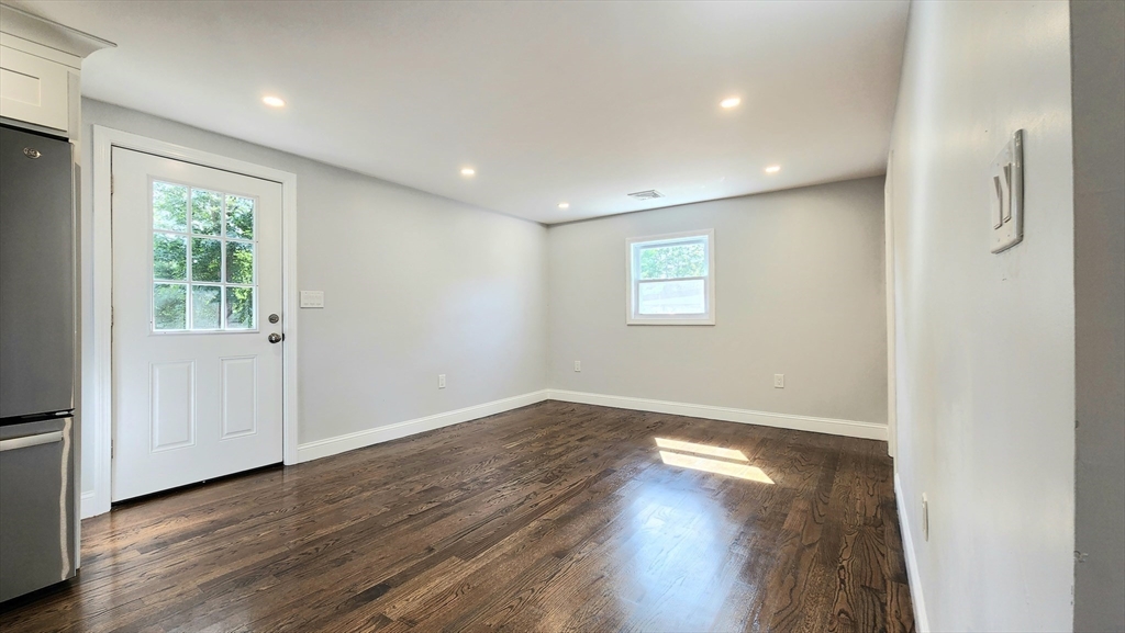 11 Christopher Road Brockton, MA 02302 - Photo 8 of 22 an empty room with wooden floor and windows