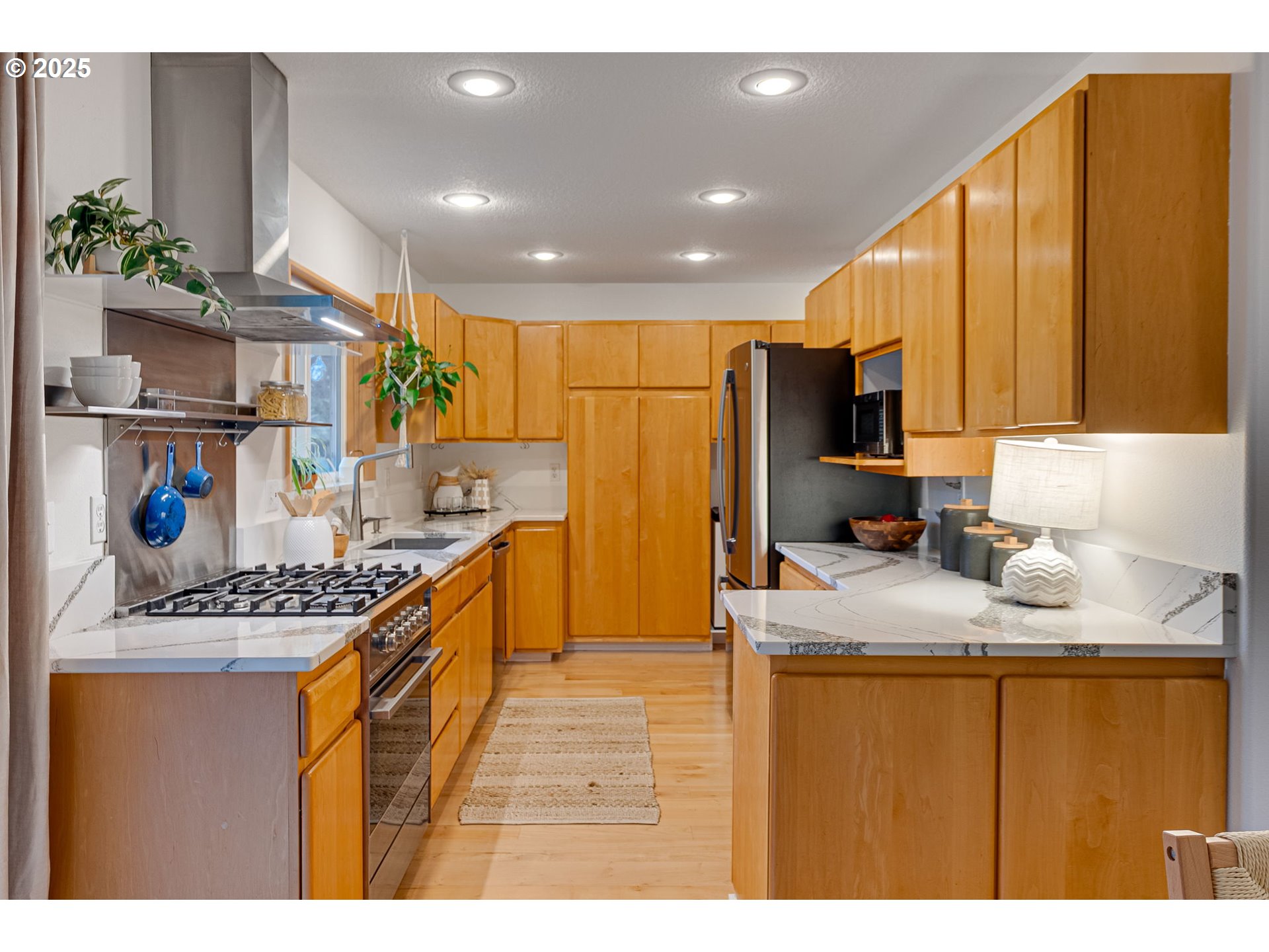 2733 Northeast 92nd Avenue Portland, OR 97220 - Photo 16 of 48 a kitchen with stainless steel appliances granite countertop a sink stove and refrigerator