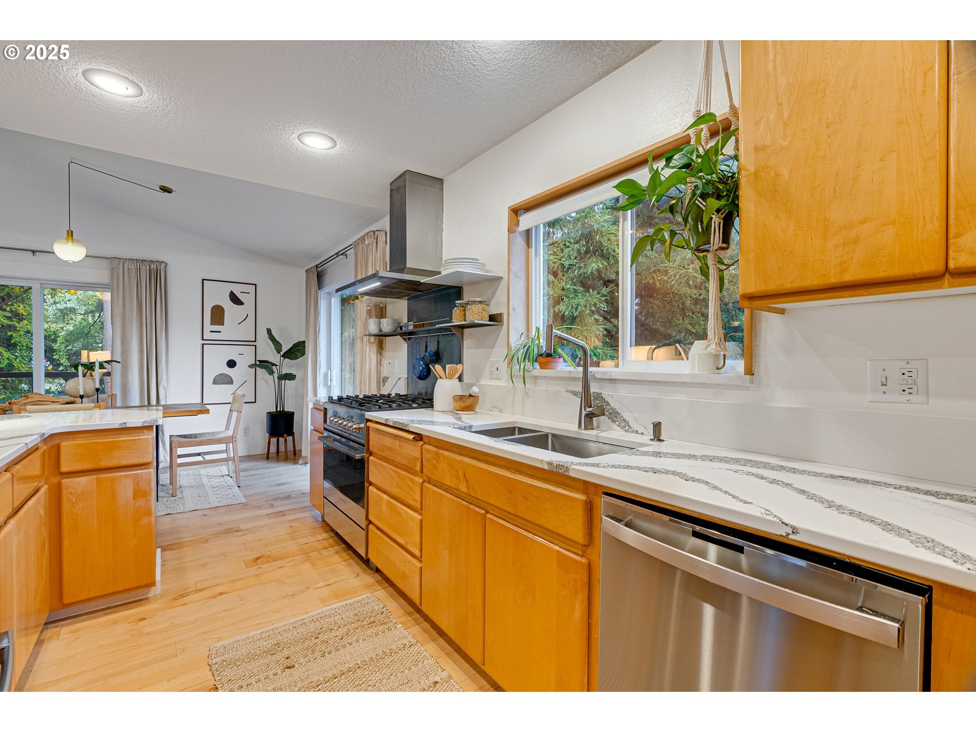 2733 Northeast 92nd Avenue Portland, OR 97220 - Photo 19 of 48 a kitchen with stainless steel appliances a sink stove and cabinets