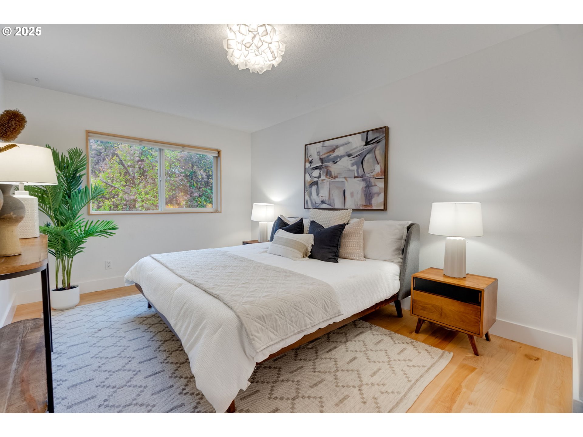 2733 Northeast 92nd Avenue Portland, OR 97220 - Photo 21 of 48 a bedroom with a bed and a potted plant