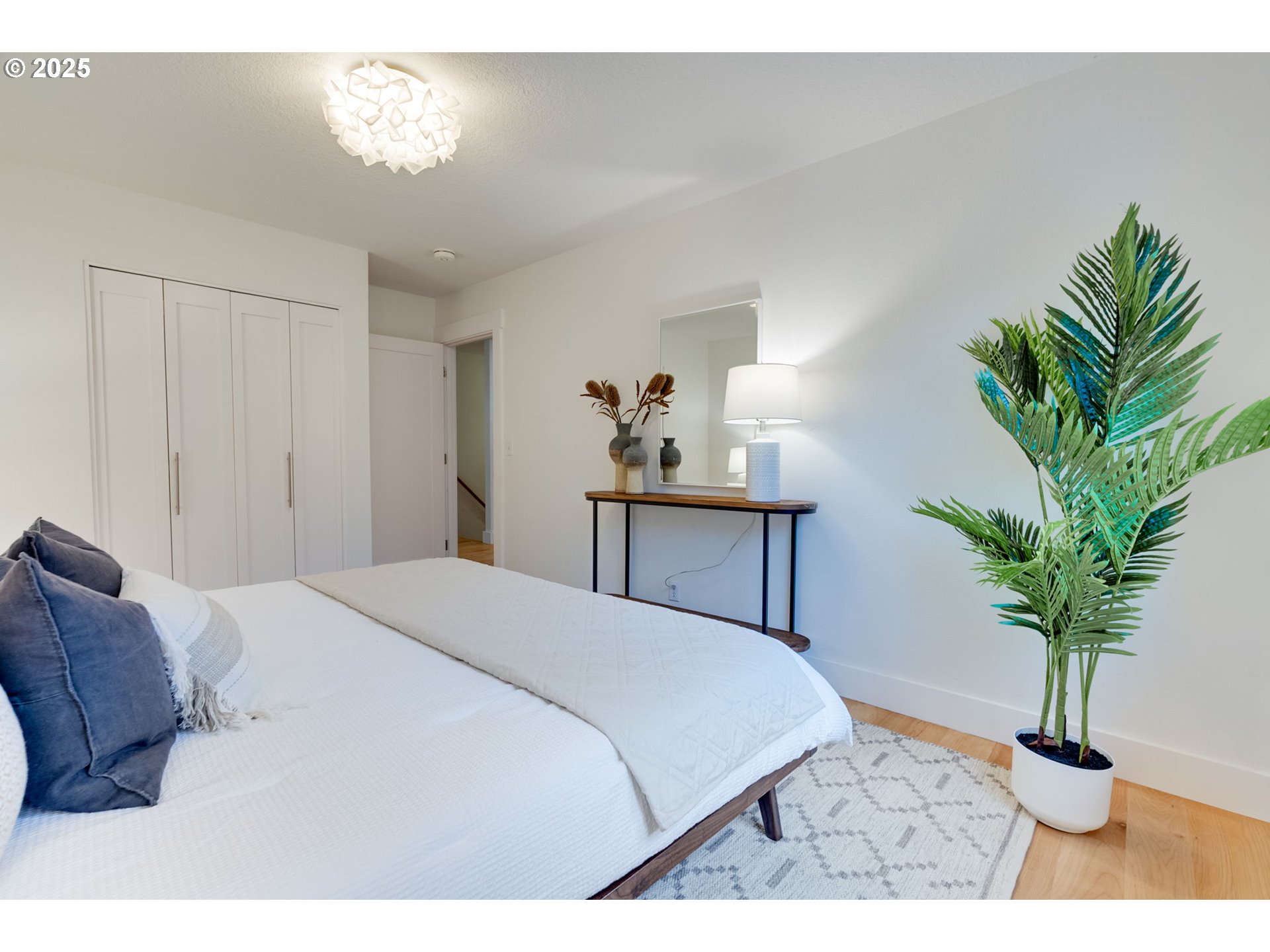 2733 Northeast 92nd Avenue Portland, OR 97220 - Photo 22 of 48 a bedroom with a bed and a potted plant