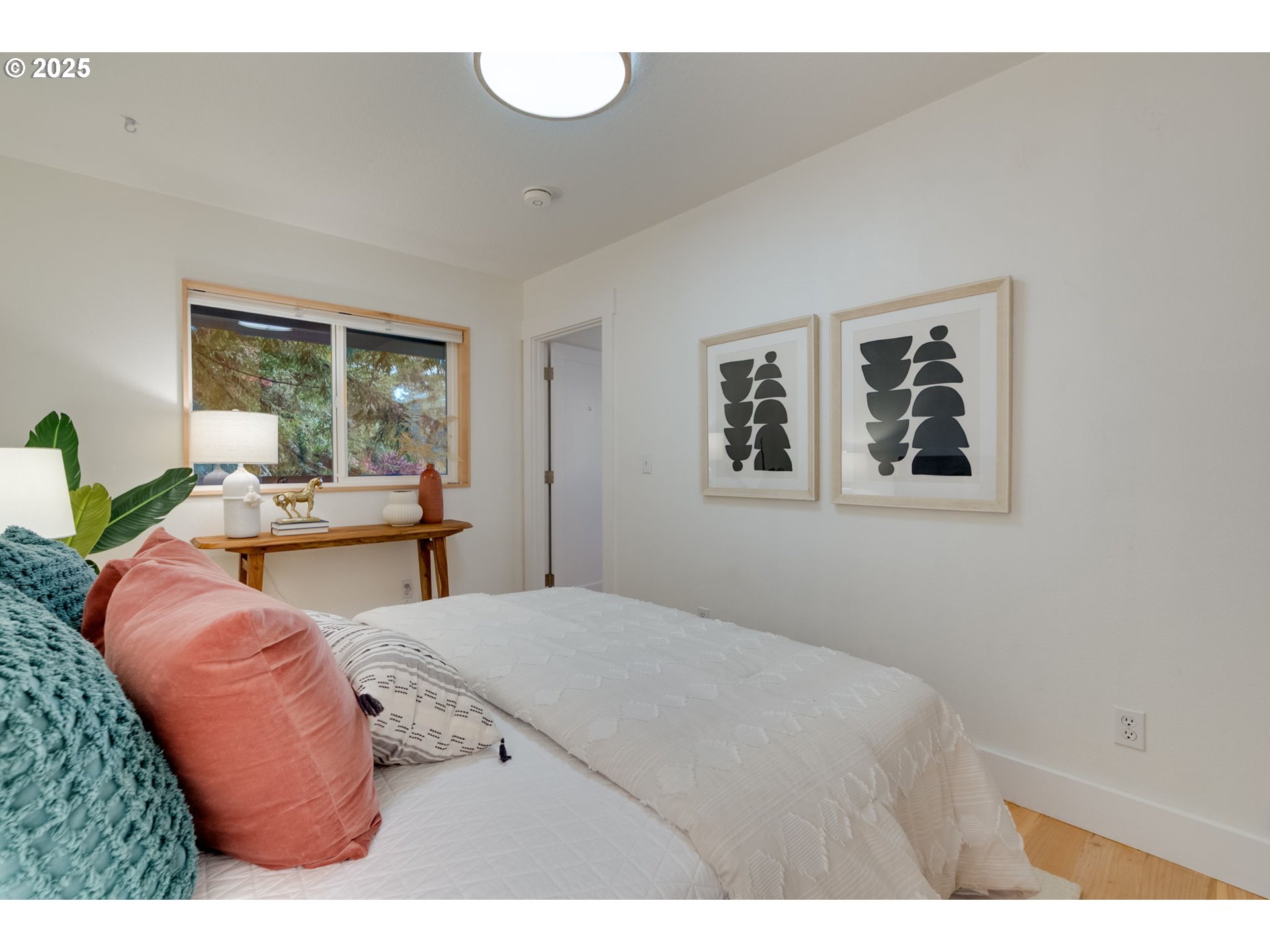2733 Northeast 92nd Avenue Portland, OR 97220 - Photo 35 of 48 a bed room with a bed and a painting on the wall
