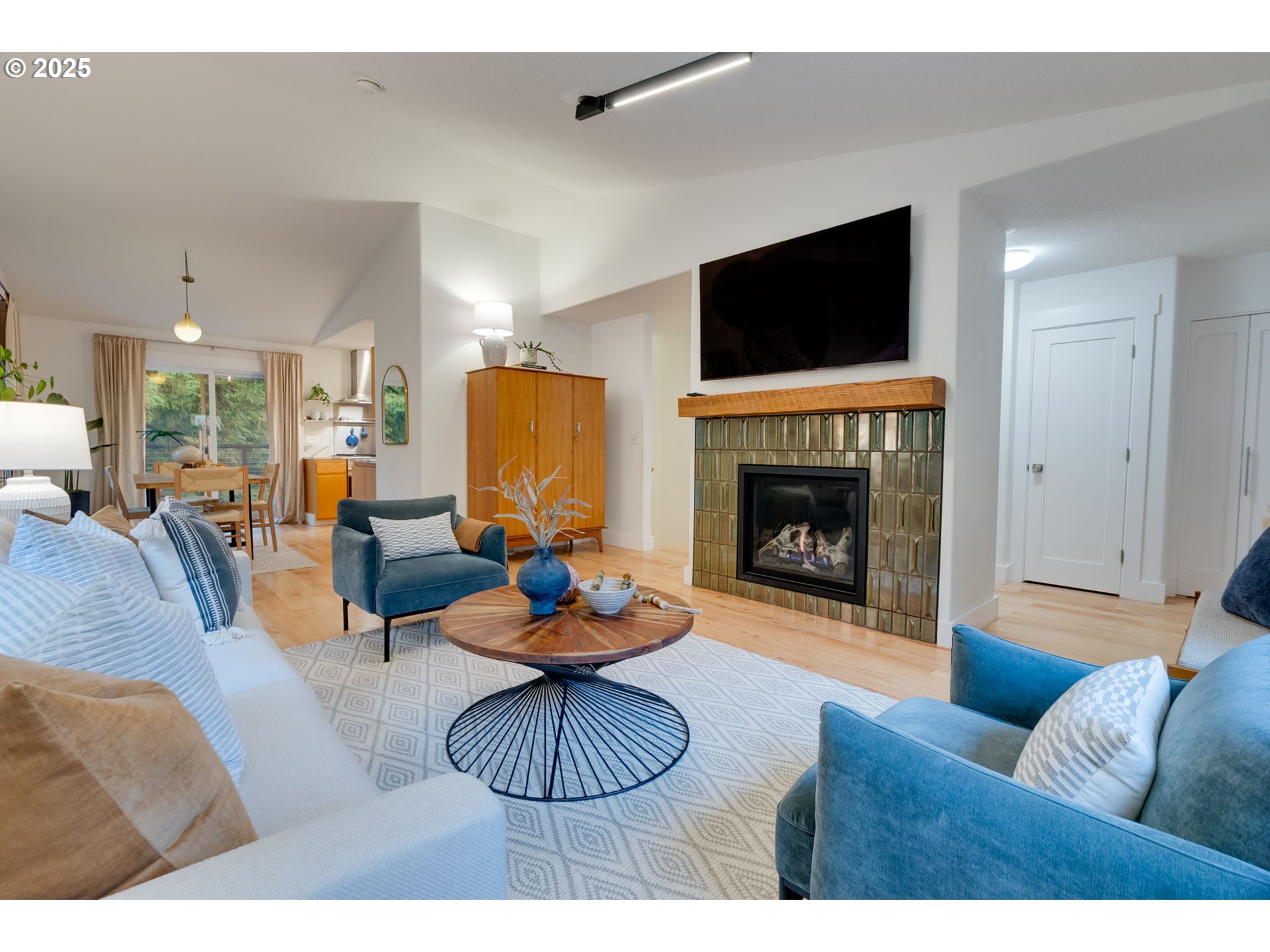 2733 Northeast 92nd Avenue Portland, OR 97220 - Photo 9 of 48 a living room with furniture a flat screen tv and a fireplace