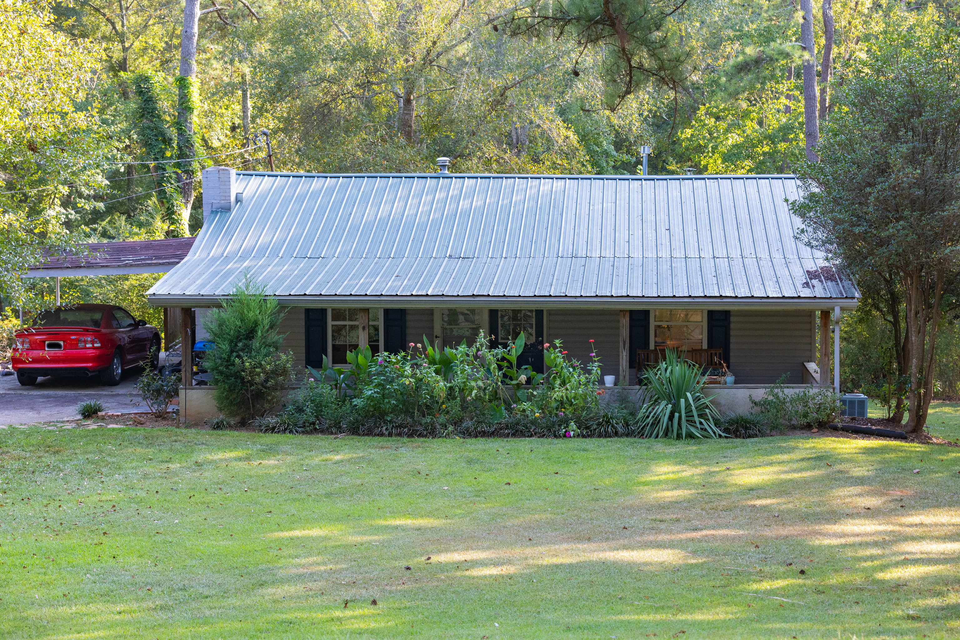 156 Burnham Road Newnan, GA 30263 - Photo 1 of 1 a view of a house with garden and plants