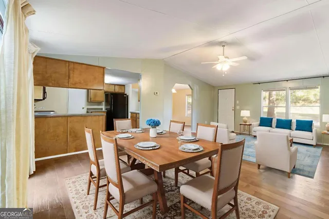 a kitchen with stainless steel appliances granite countertop a refrigerator stove and sink