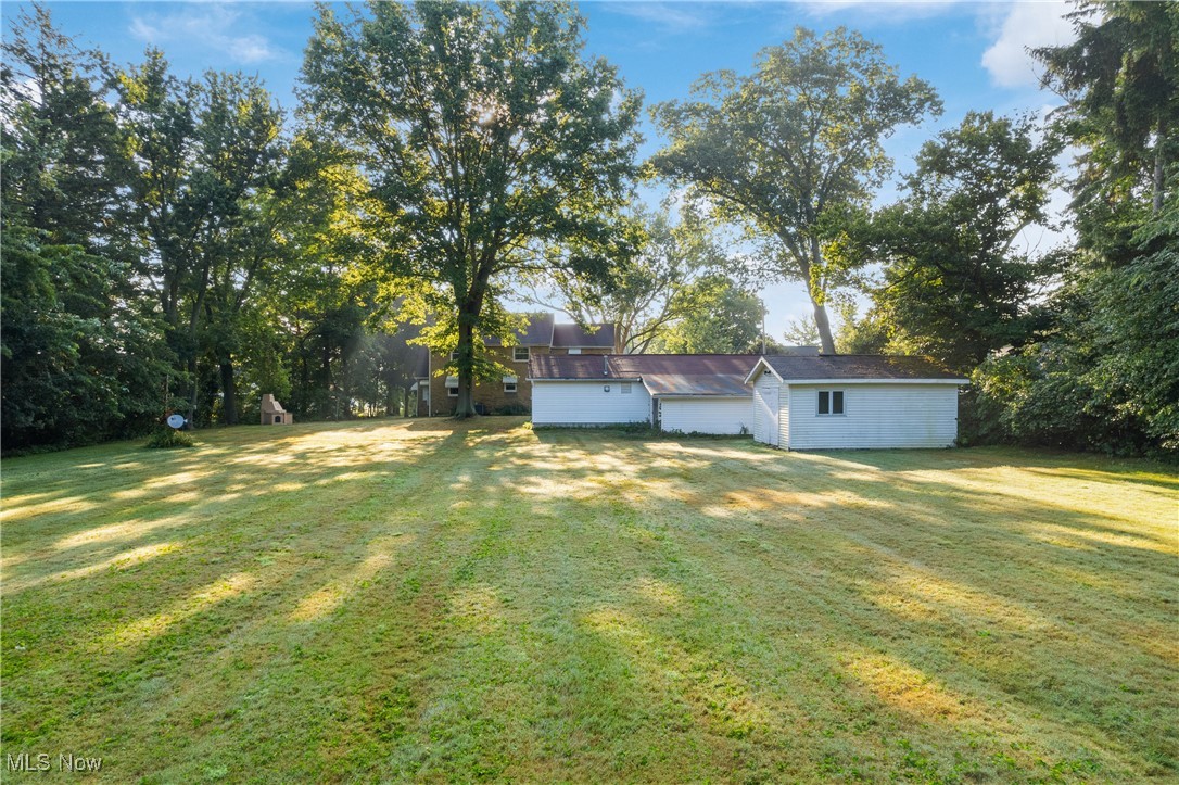 3550 Manchester Road Akron, OH 44319 - Photo 36 of 40 View of yard featuring an outdoor structure and a garage